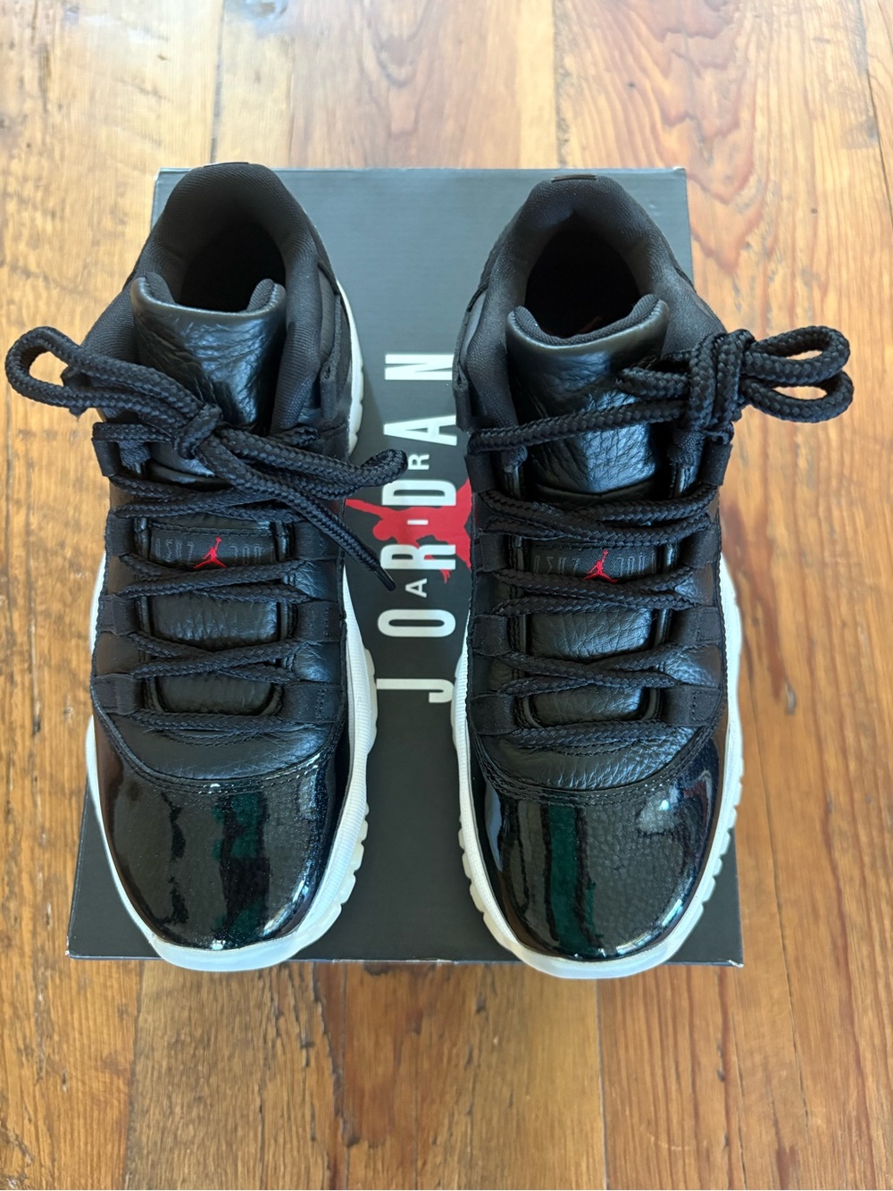Air Jordan 11 Retro Low (GS) Sneakers in Black, Gym Red, White, and Sail, NEW